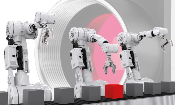 Illustration of robots standing in front of a camera and grabbing cubes from a conveyor belt.