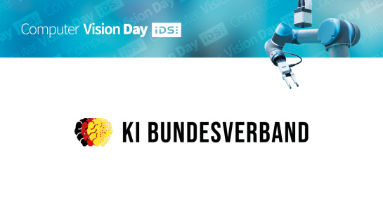 Logo of the German Federal Association for Artificial Intelligence and IDS, Computer Vision Day, robot with gripper and IDS camera