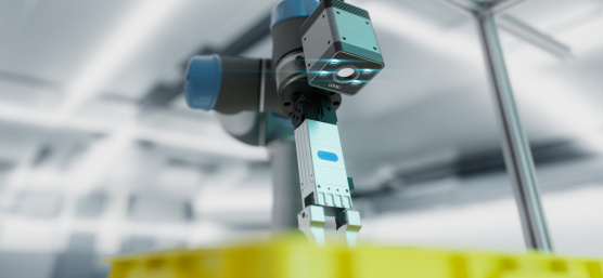 Robotic arm with a Nion 3D camera above a yellow box