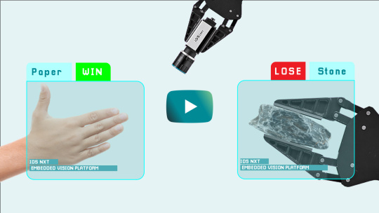 Thumbnail for video in which a human plays rock, paper, scissors with a robotic arm