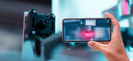 Smartphone displays automation process, alongside a uEye live monitoring camera
