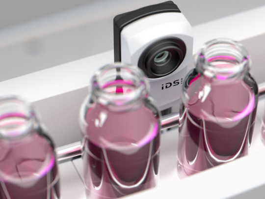Behind a treadmill with glasses and violet-coloured liquids, a uEye XC checks