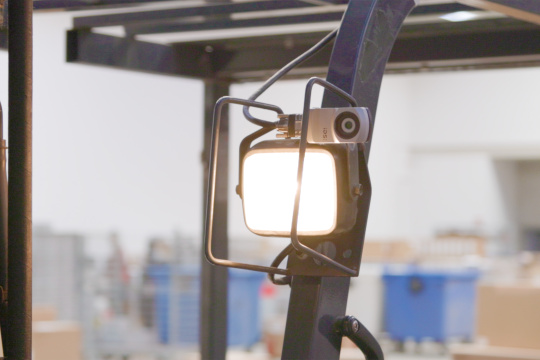 uEye XC mounted on the front spar of a forklift truck above a lamp.