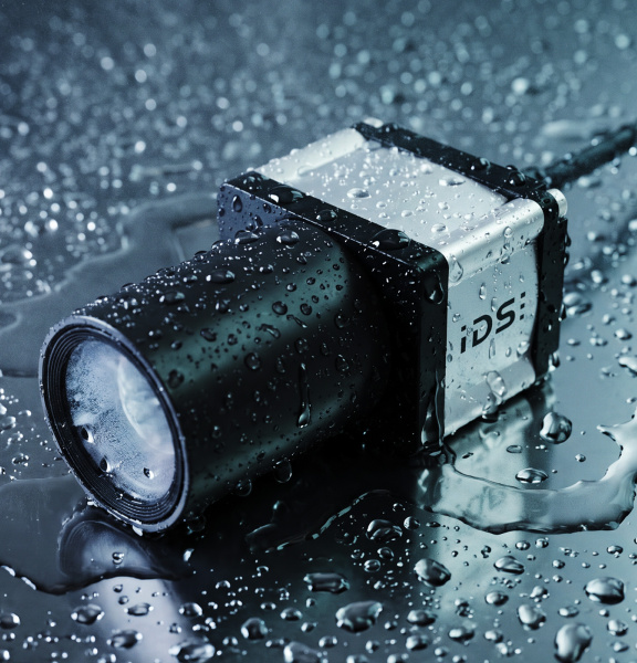 IDS industrial camera with lens on a wet surface