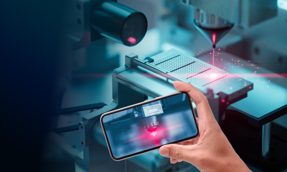 Smartphone displays laser cutting process monitored by IDS camera.