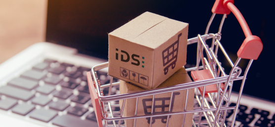Shopping cart with IDS packages on a laptop keyboard