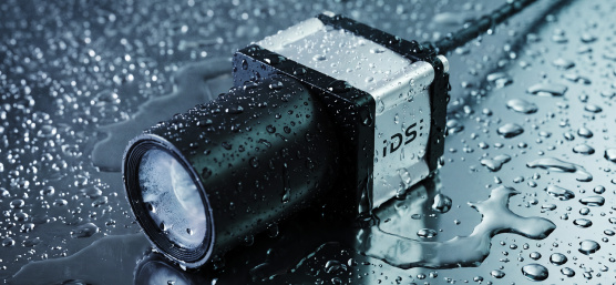 IDS industrial camera with lens on a wet surface