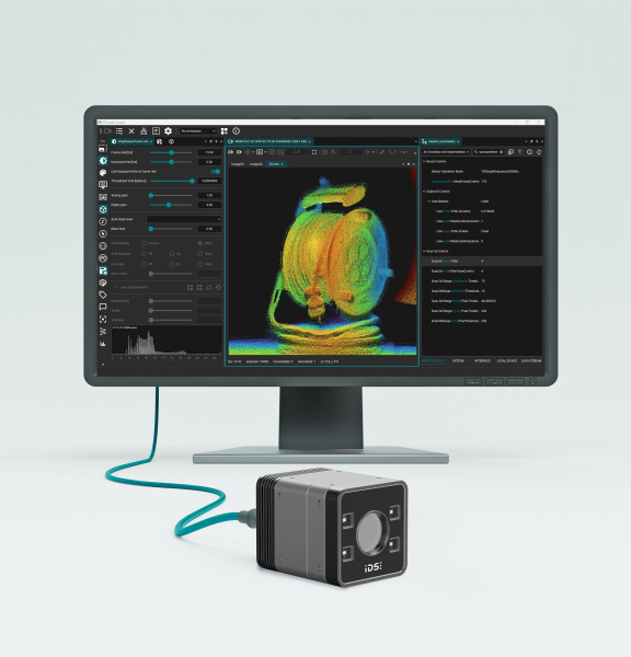 3D camera in front of a monitor displaying a coloured point cloud and a software interface