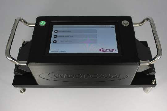 WESTCAM device with touchscreen, green power button and metal handles