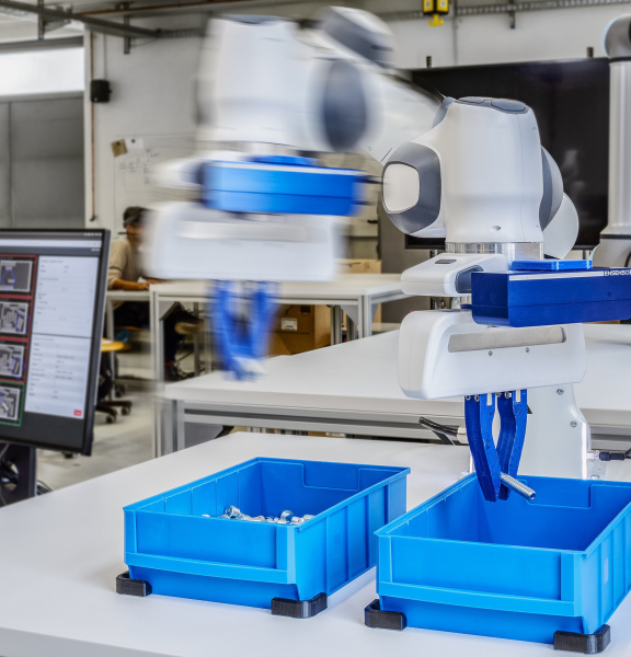 A fast-moving robotic arm with Ensenso cameras sorts screws