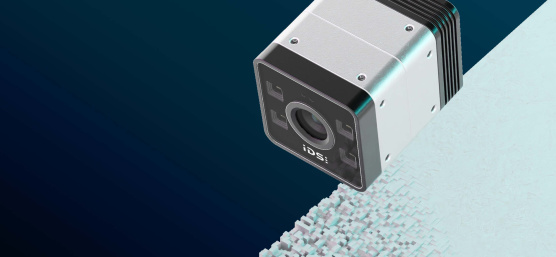 IDS iTof 3D camera in front of a background with three-dimensional elevations.