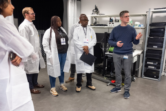 MIT REAP delegation during a tour of the IDS optics laboratory.