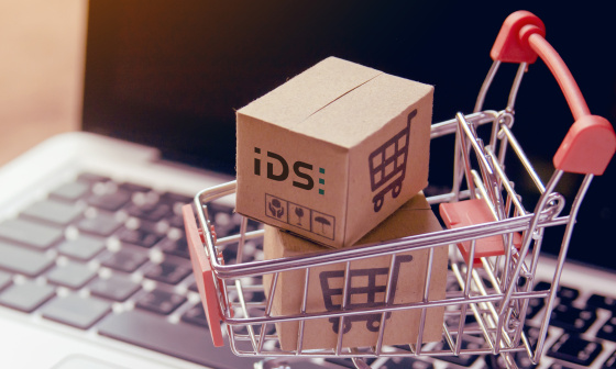 Shopping cart with IDS packages on a laptop keyboard