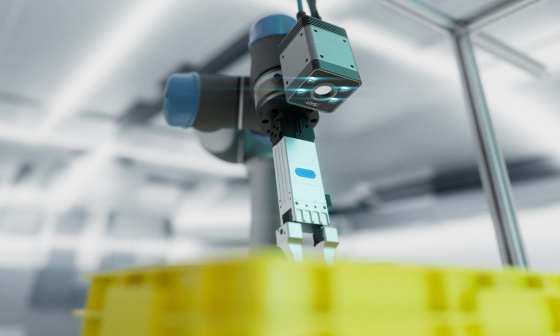 Robotic arm with a Nion 3D camera above a yellow box