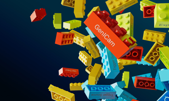 Colourful Lego bricks with lettering loose in front of dark background.