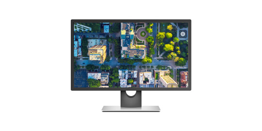 Monitor displaying an aerial view of a city from above
