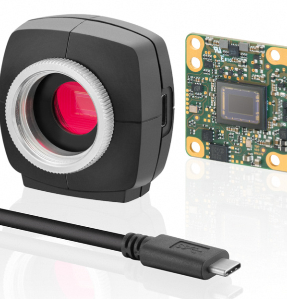 Picture of a uEye camera, left with housing, right without, cable in front