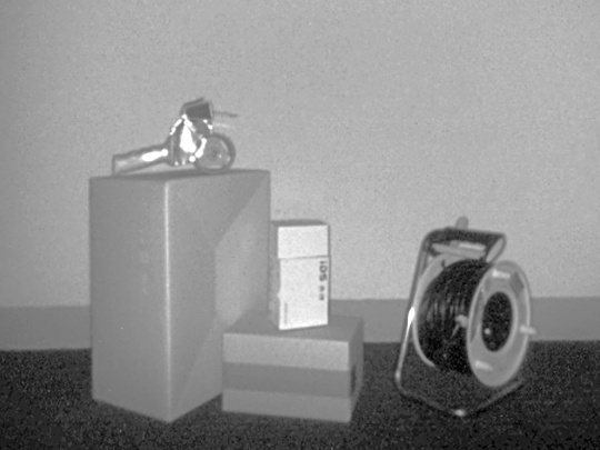 A grey intensity image from the Nion 3D camera shows various objects in front of a wall