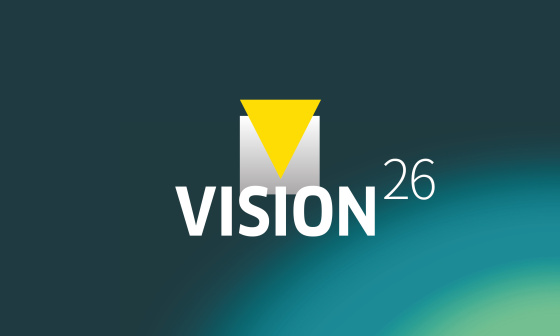 Graphic featuring the text «VISION26» on a teal background.