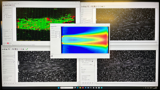 Software interface with particle images and colour-coded flow analysis from event-based camera data