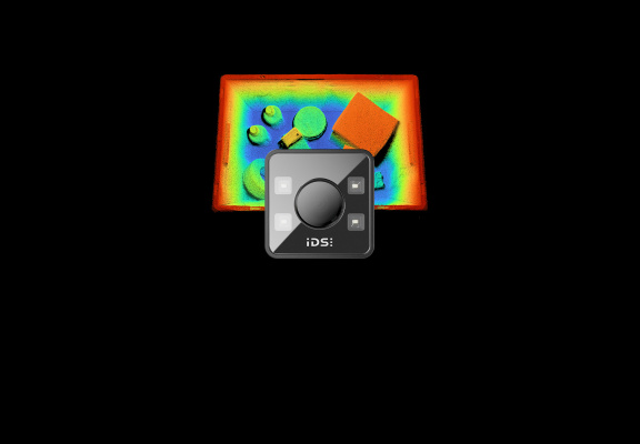3D ToF camera in front of a colour-coded depth map featuring various objects