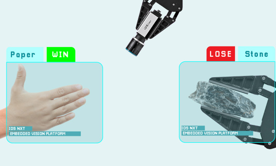 An IDS camera detects a hand and a gripper and shows who has won.