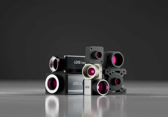 Several IDS cameras stacked side by side against a dark background