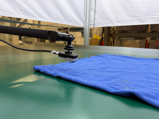 uEye XC camera – positioned above a blue T-shirt – takes a close-up shot.