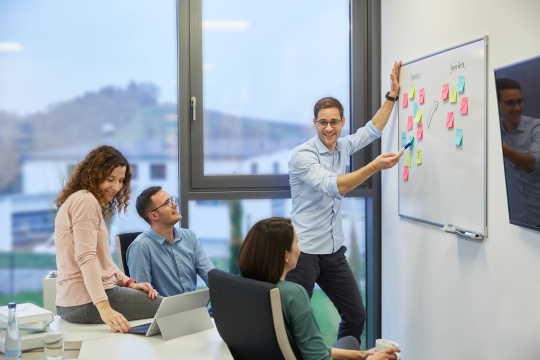 Team meeting at IDS in a relaxed atmosphere in modern equipped office