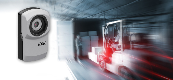uEye XC camera hovers next to dynamic scene with forklift and truck.
