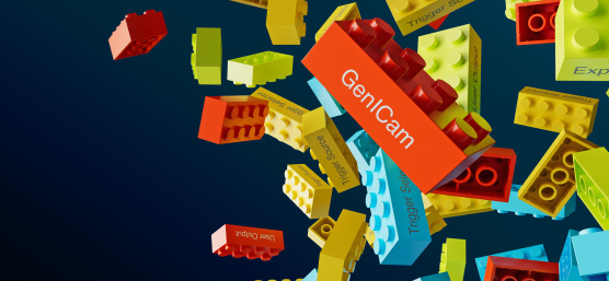 Colourful Lego bricks with lettering loose in front of dark background.