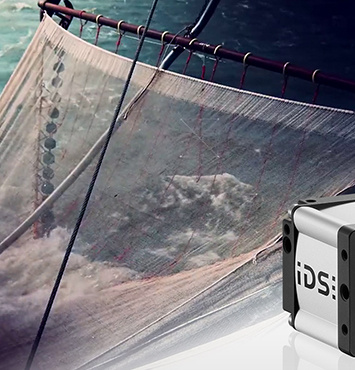 A fishing net in the sea, with an IDS industrial camera in the foreground.